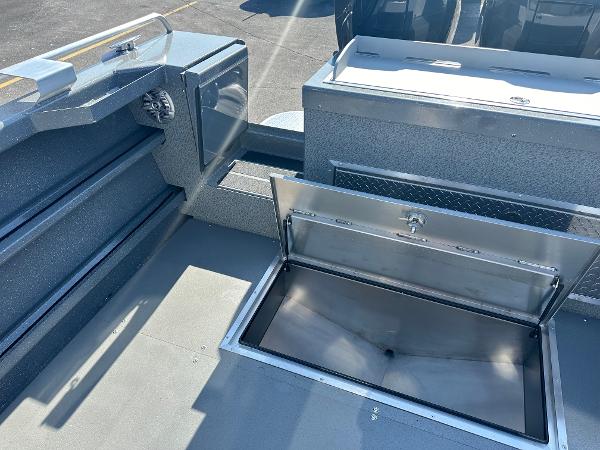 2024 Spartan 260 Maximus Pro XL boat with open storage compartment.