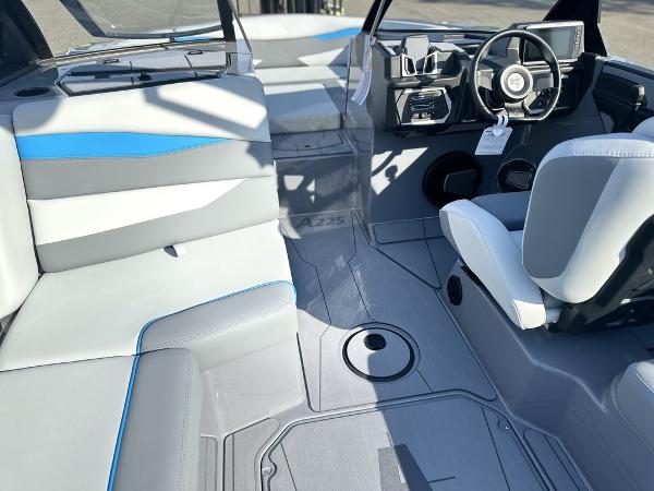 2025 Axis A225 boat interior with modern seating and steering console.