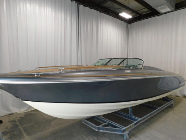 2021 Chris-Craft Corsair 34 boat in a showroom.