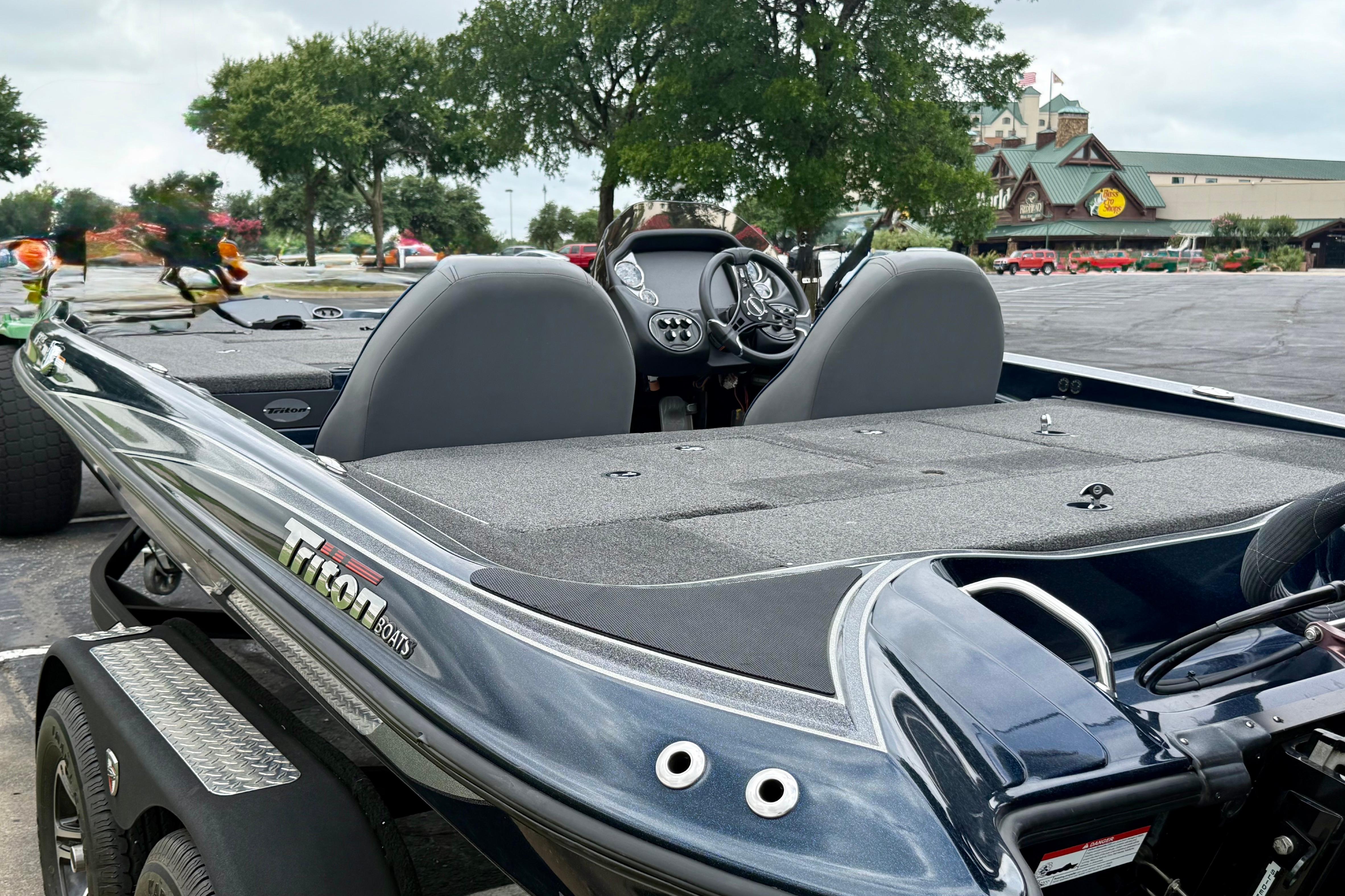 2023 Triton 18 TrX boat interior with dual seats and control panel.