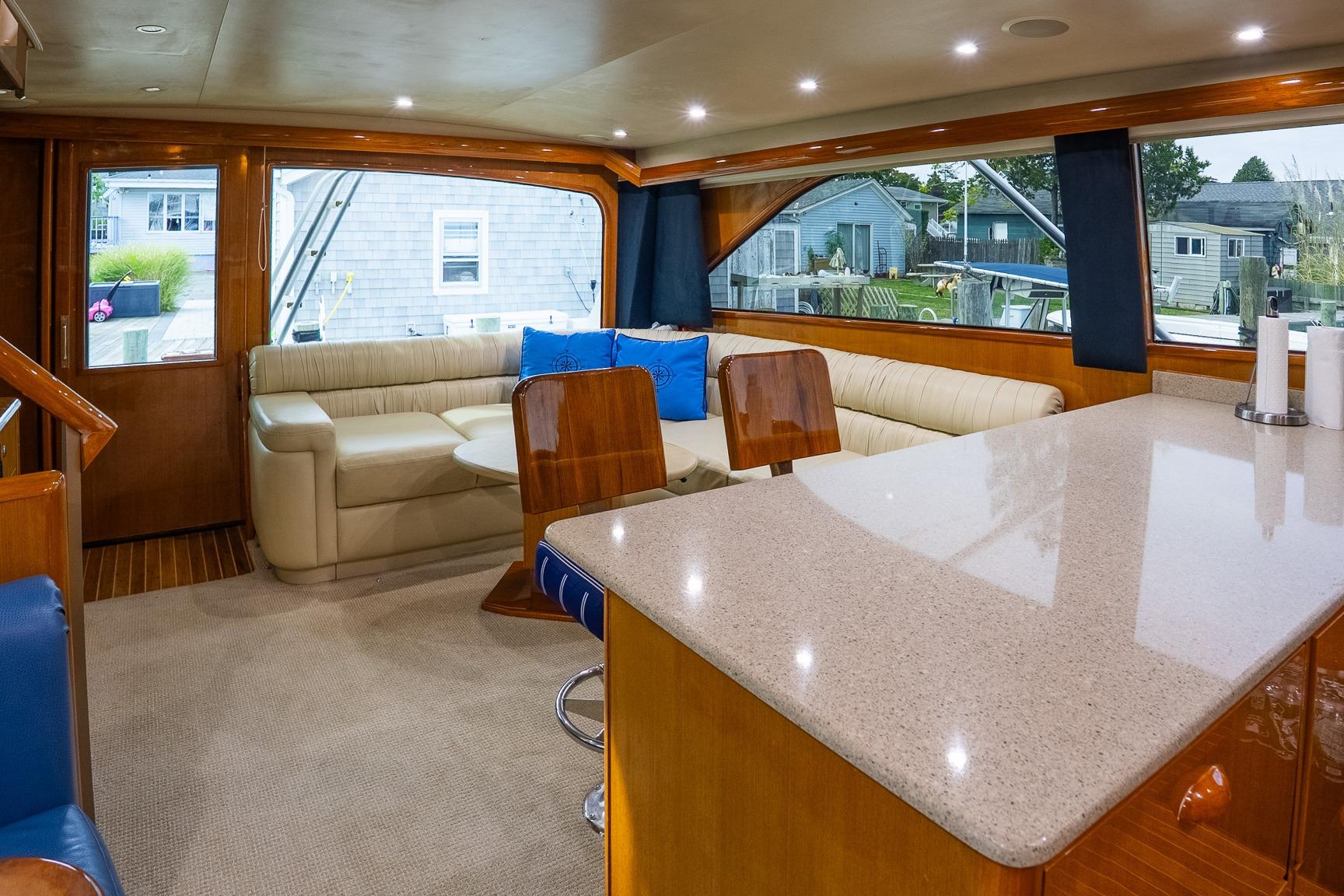 Luxurious interior of 2002 Viking 61 Enclosed Bridge yacht with elegant seating and modern design.