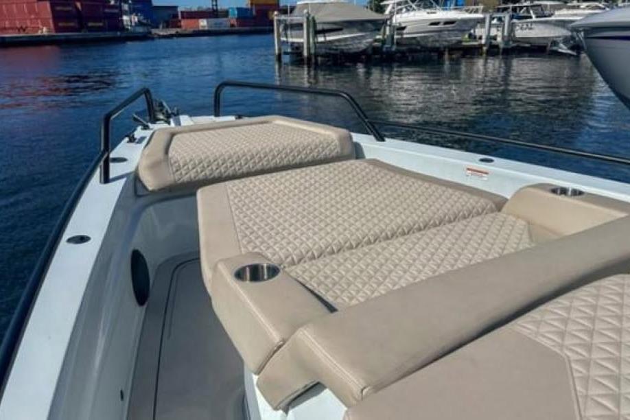 2023 BRABUS Shadow 900 ST luxury boat with quilted seating at marina.