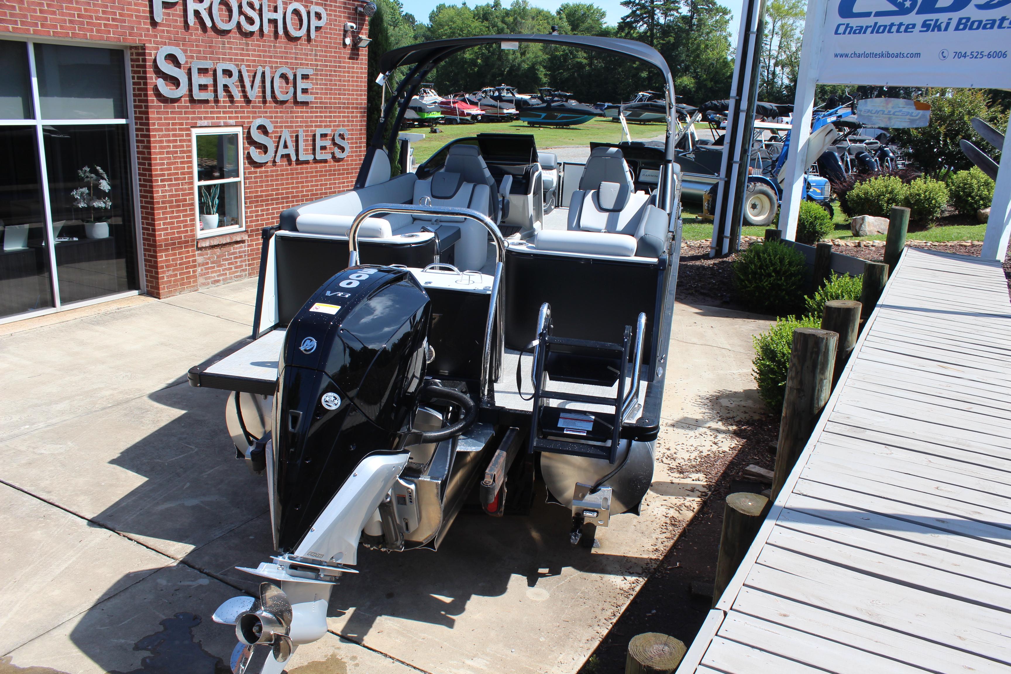 2025 Tahoe Pontoon Cascade Quad Lounge Windshield at dealership, showcasing sleek design and powerful engine.
