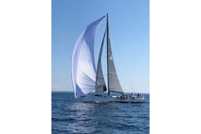 Sailing yacht Andrews 63, 2000 model, with full sails on open sea.
