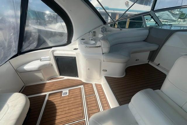 2004 Cruisers Yachts 3372 Express interior with seating and wood flooring.