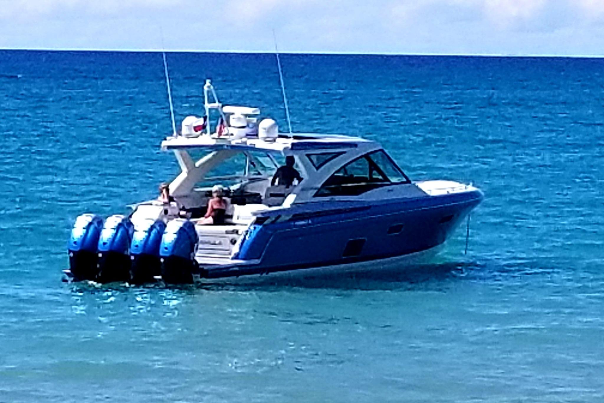 2019 Formula 430 Super Sport Crossover boat cruising on clear blue ocean waters.