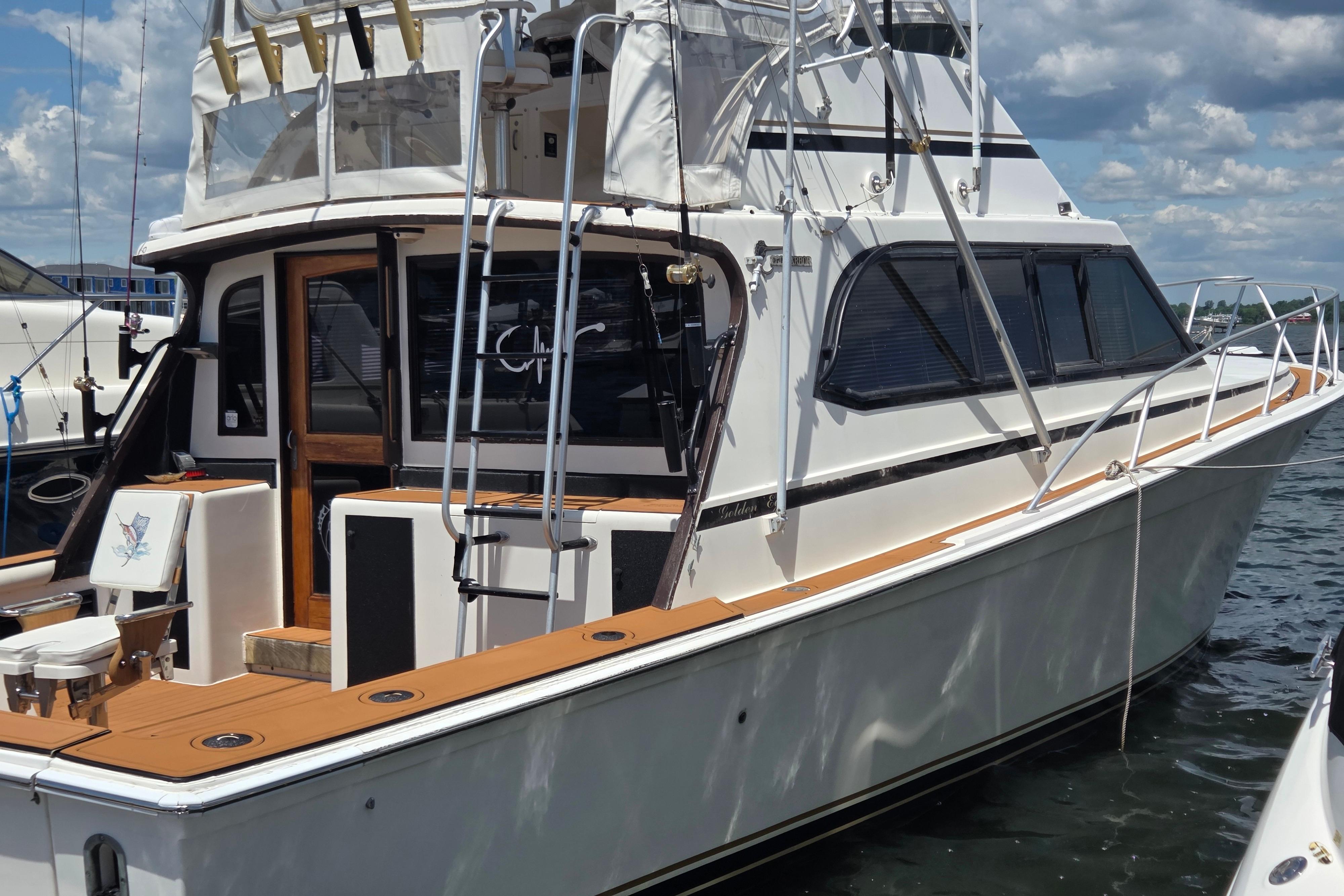 1990 Egg Harbor Golden Egg 42 yacht docked, featuring sleek design and spacious deck.