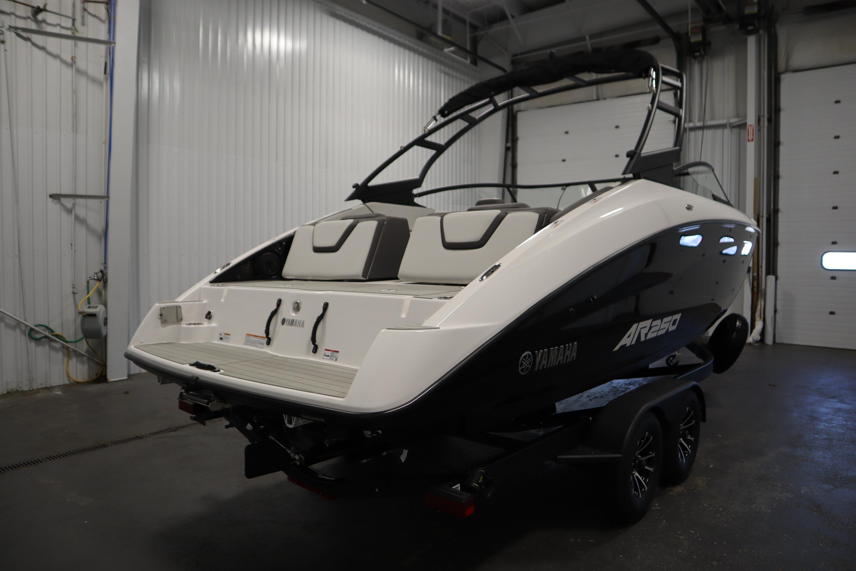 2026 Yamaha AR250 boat in a garage, showcasing sleek design and modern features.