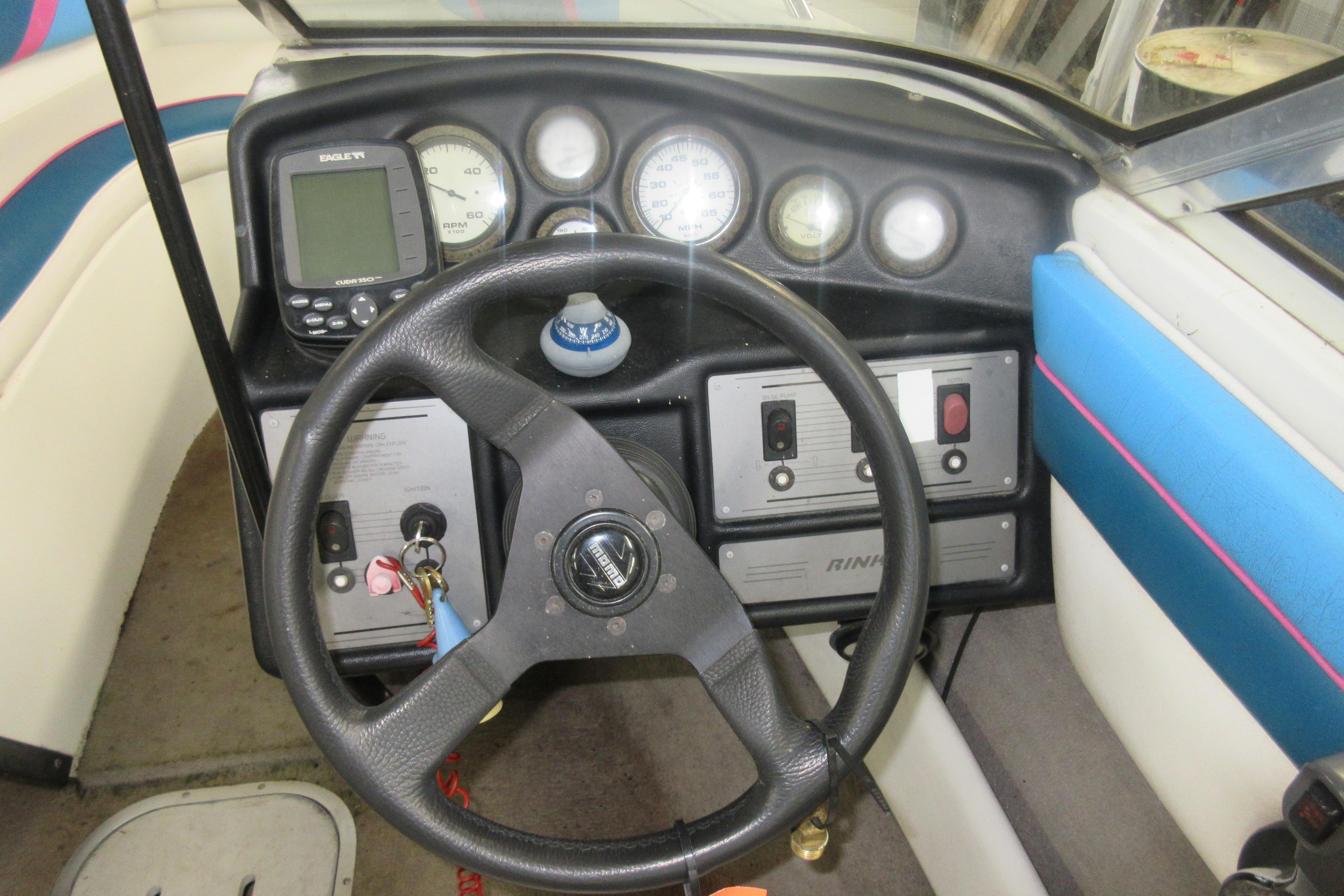 1993 Rinker 186 Captiva Bowrider dashboard with steering wheel and instrument panel.
