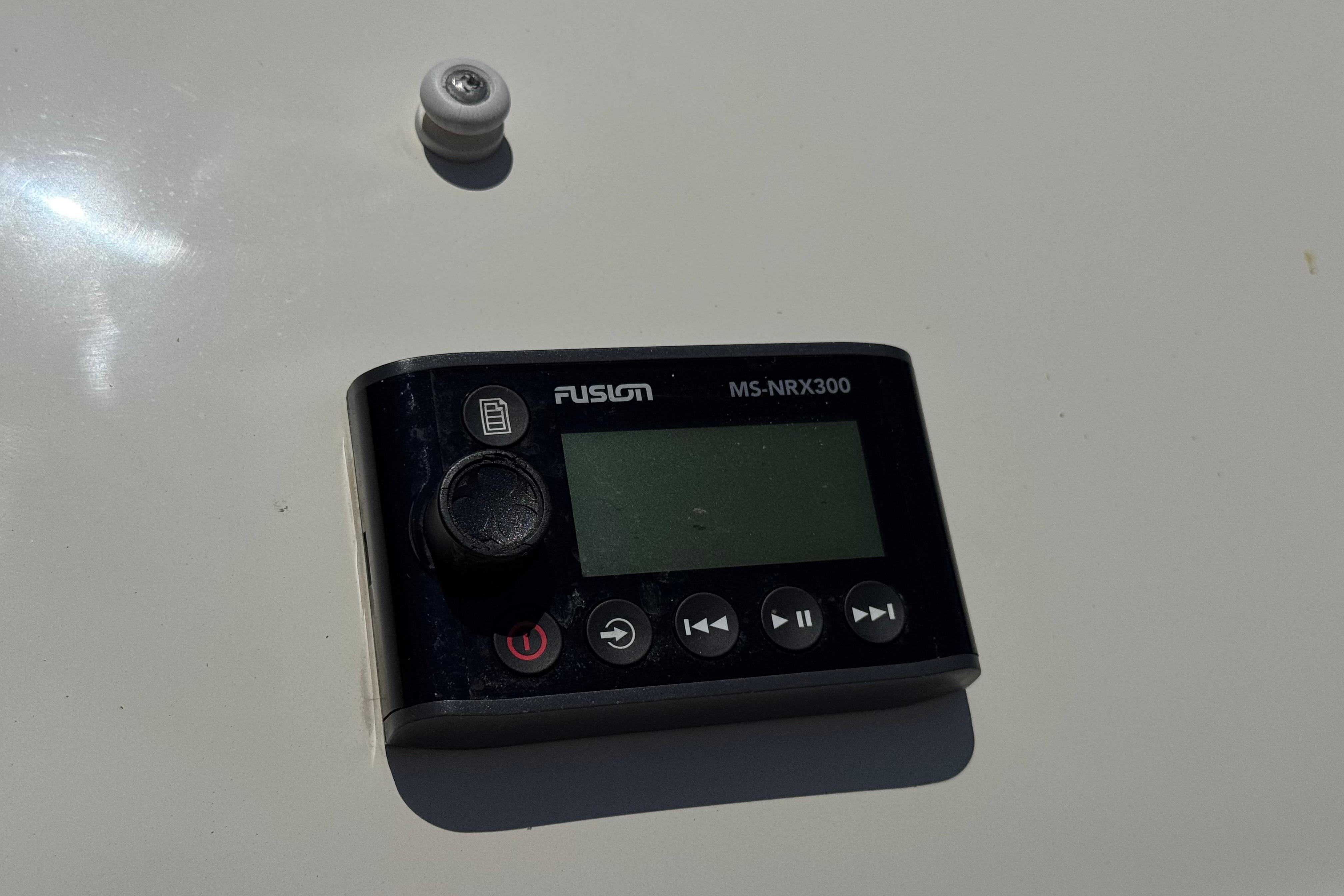 Fusion MS-NRX300 marine stereo remote on 2007 Sea Ray 240 Sundeck.