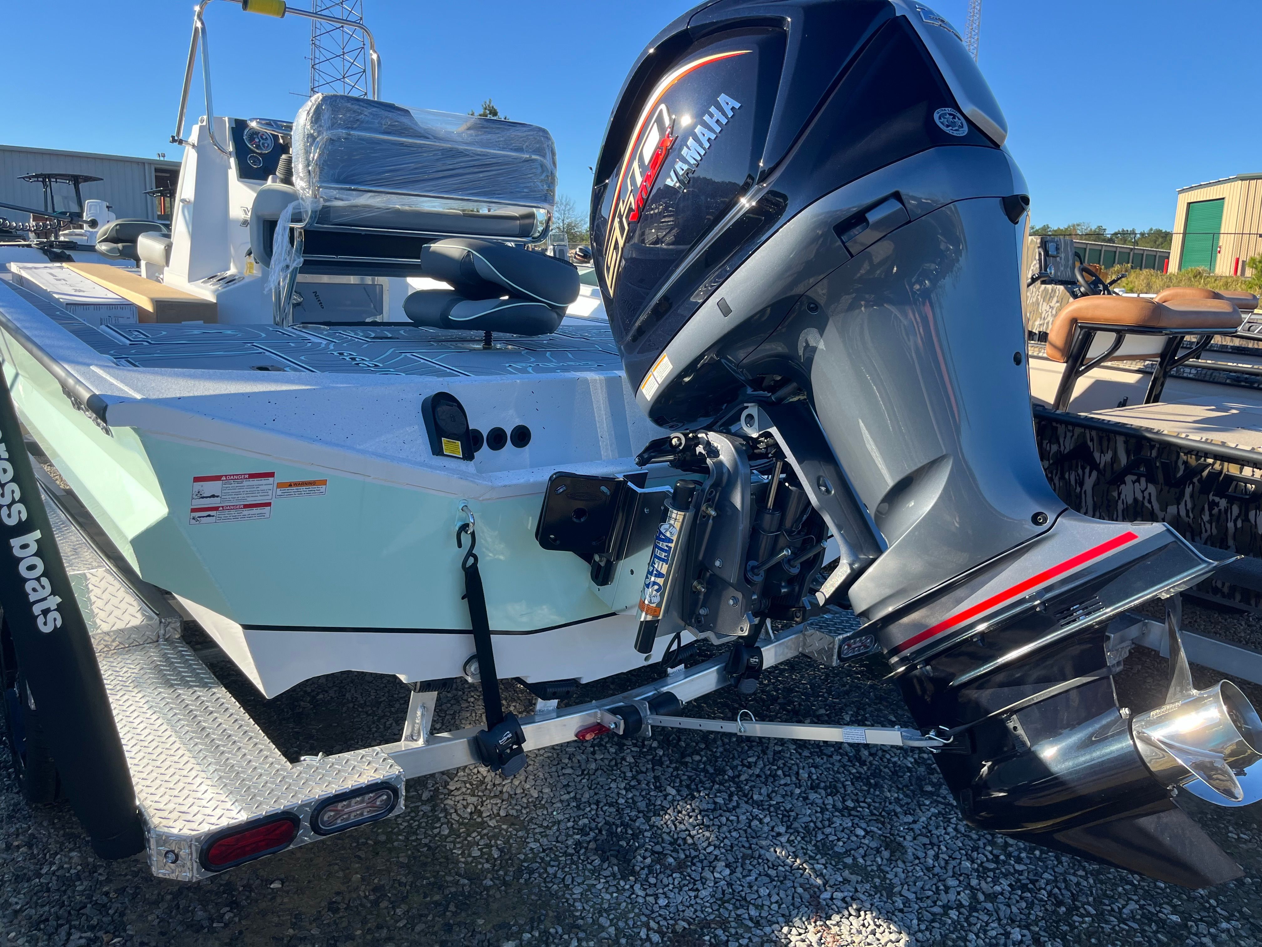 2024 Xpress X23B Bay Lounge with Yamaha outboard motor.