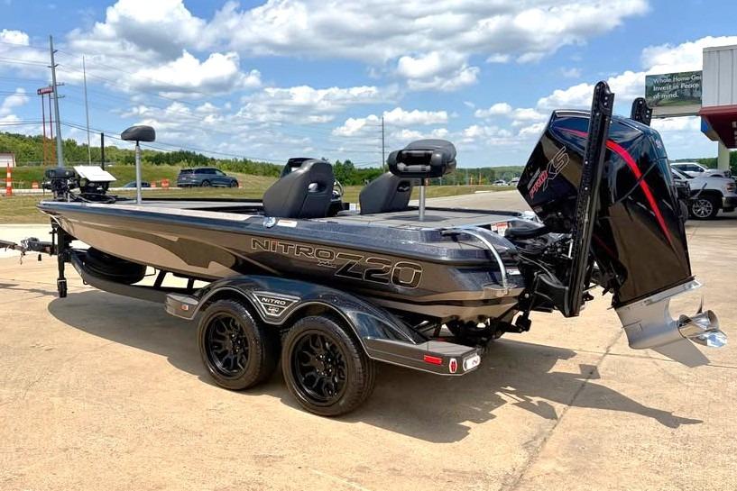 2026 Nitro Z20 XL Pro boat on trailer, parked outdoors under a cloudy sky.