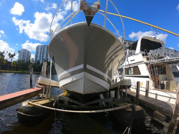 2017 Jeanneau NC 11 boat docked at a marina, front view.