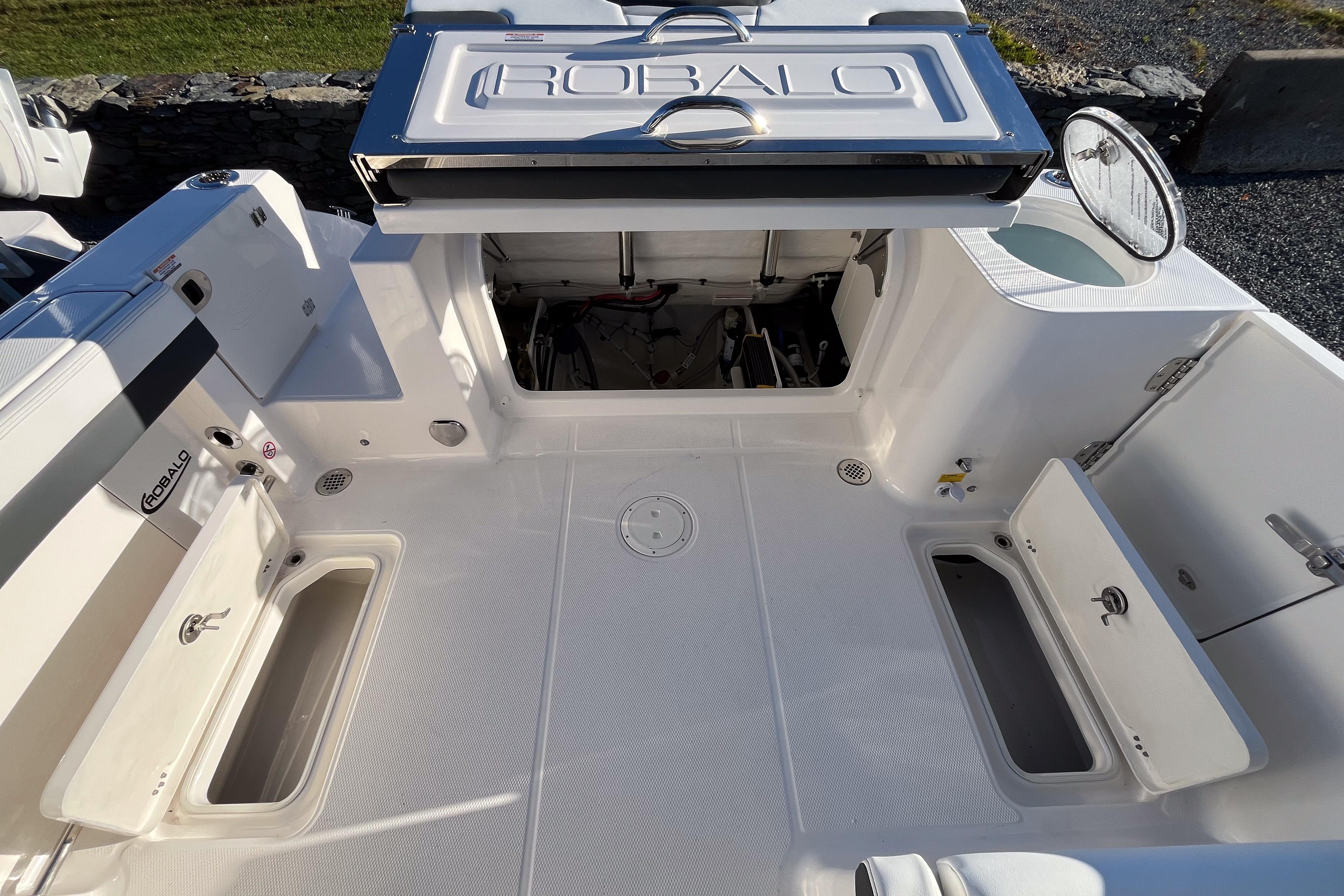 2026 Robalo R257 Dual Console boat interior with open storage compartments.