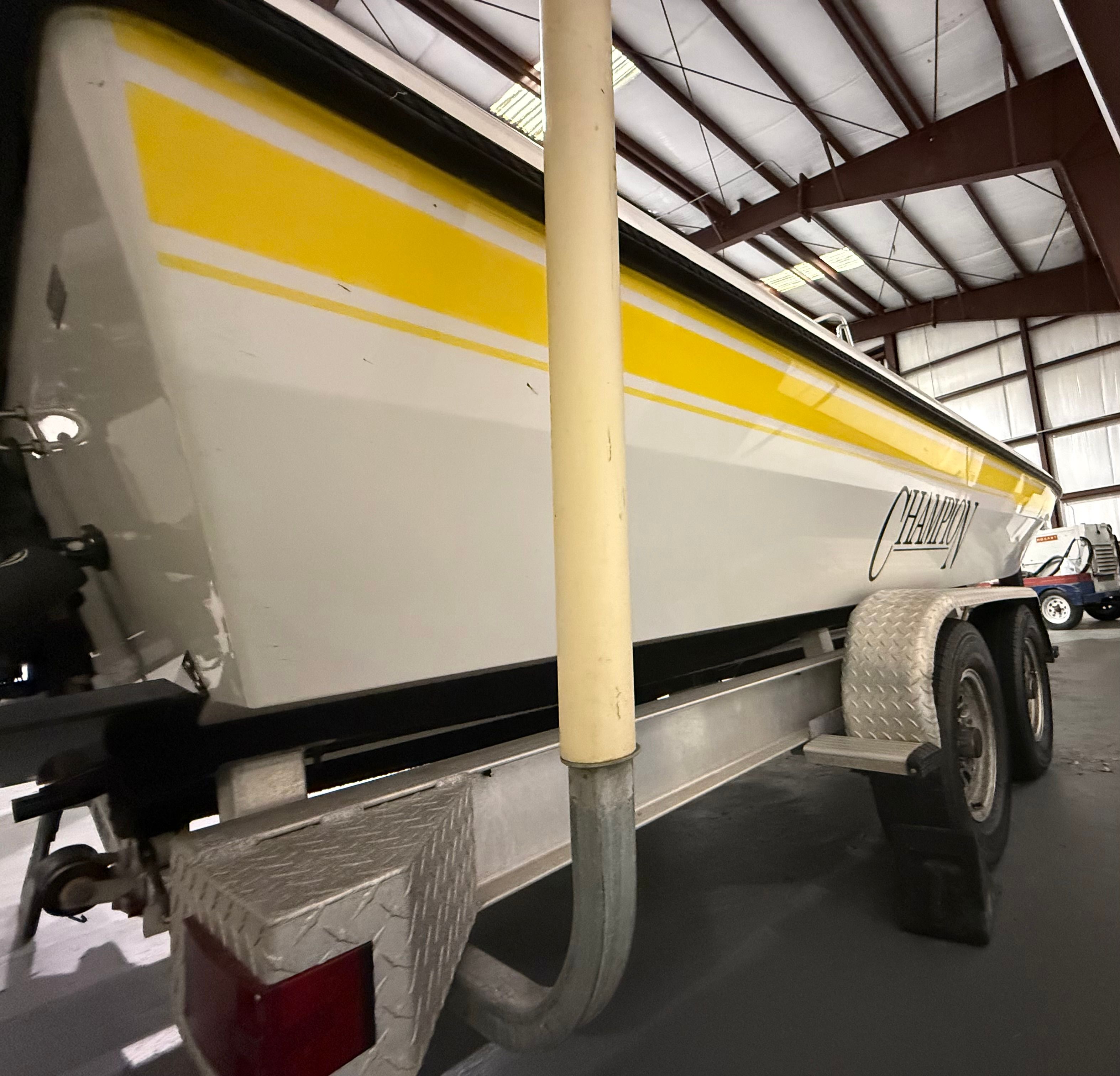 2004 Champion 24 Bay Champ in a storage facility.