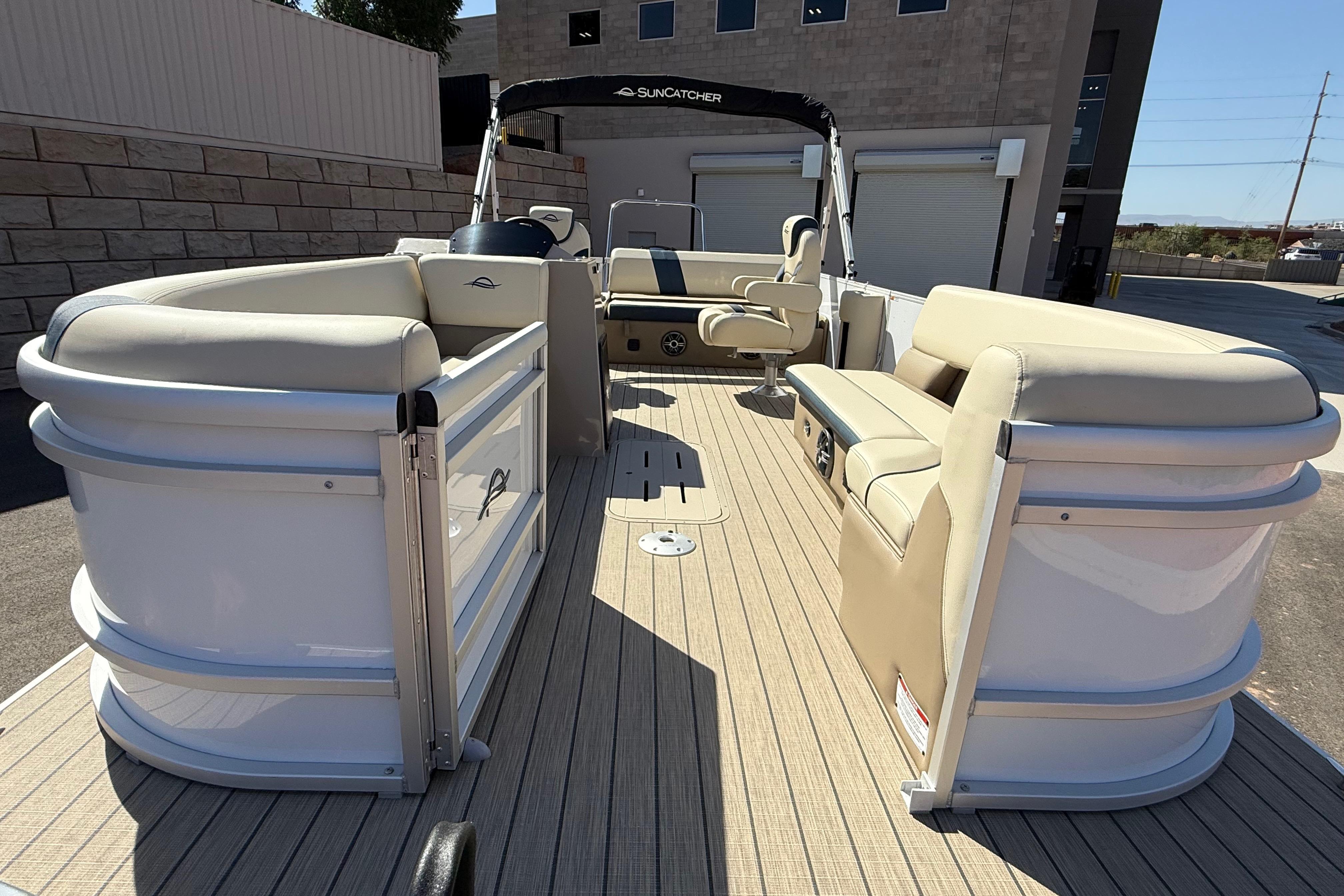 2026 SunCatcher Select 322SL pontoon boat with beige seating and spacious deck.