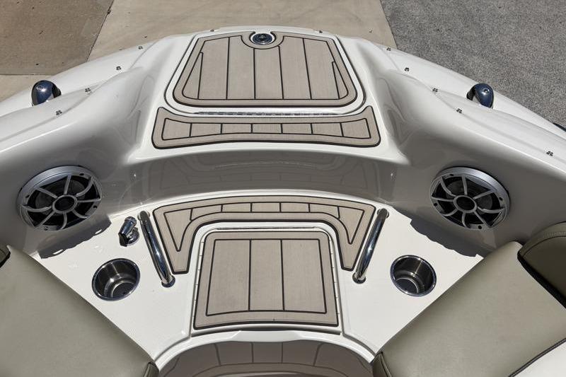 2007 Sea Ray 240 Sundeck boat interior with speakers and cup holders.