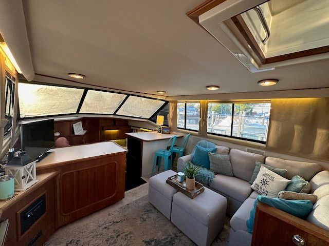 Interior of Carver 3807 Aft Cabin Yacht, cozy and modern decor.