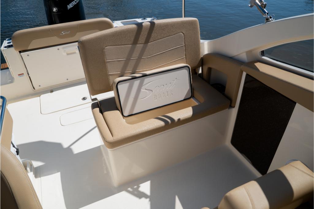 2023 Scout 240 Dorado boat interior with beige seating and storage compartment.