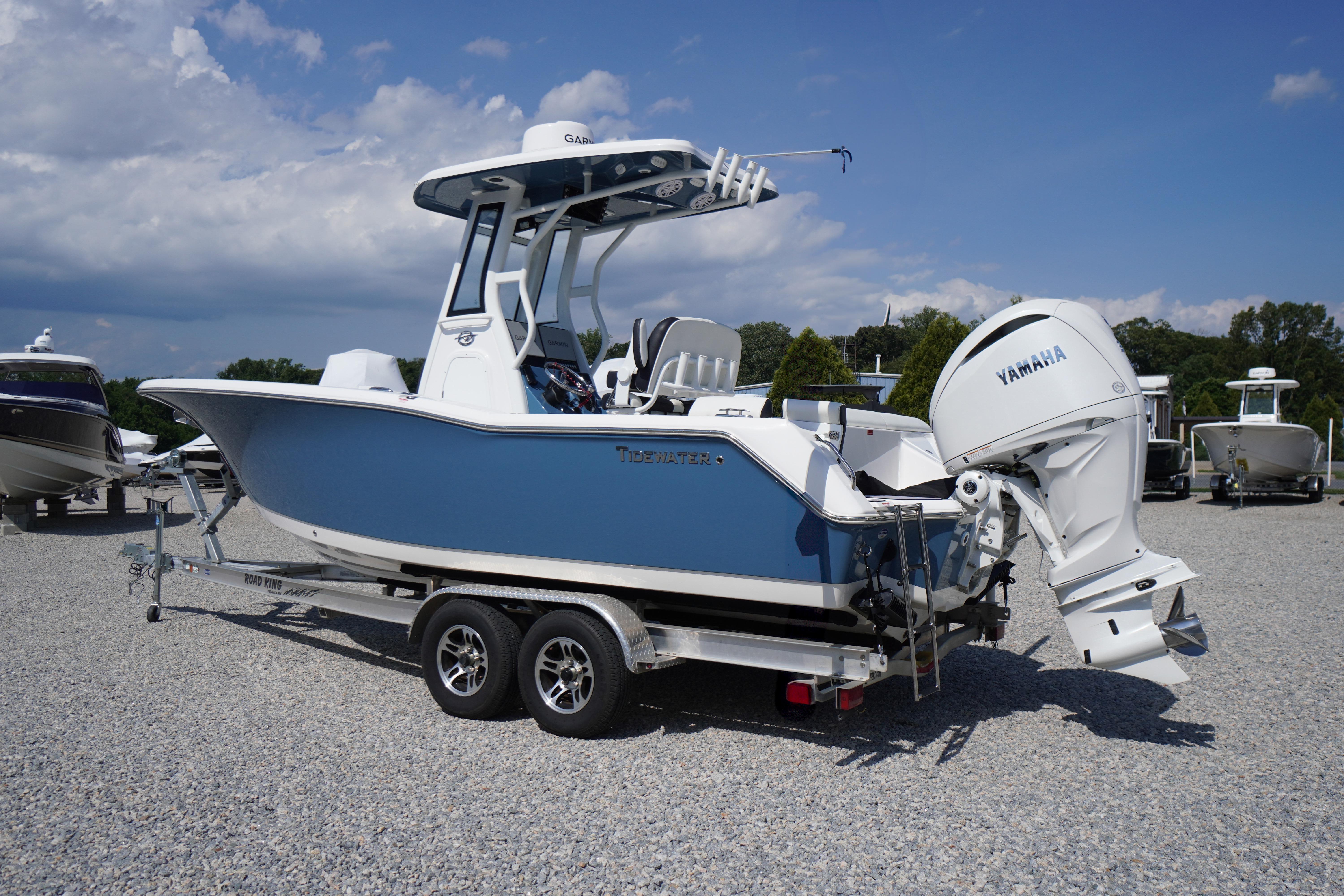 2025 Tidewater 232 SS boat with Yamaha engine on trailer, parked outdoors.