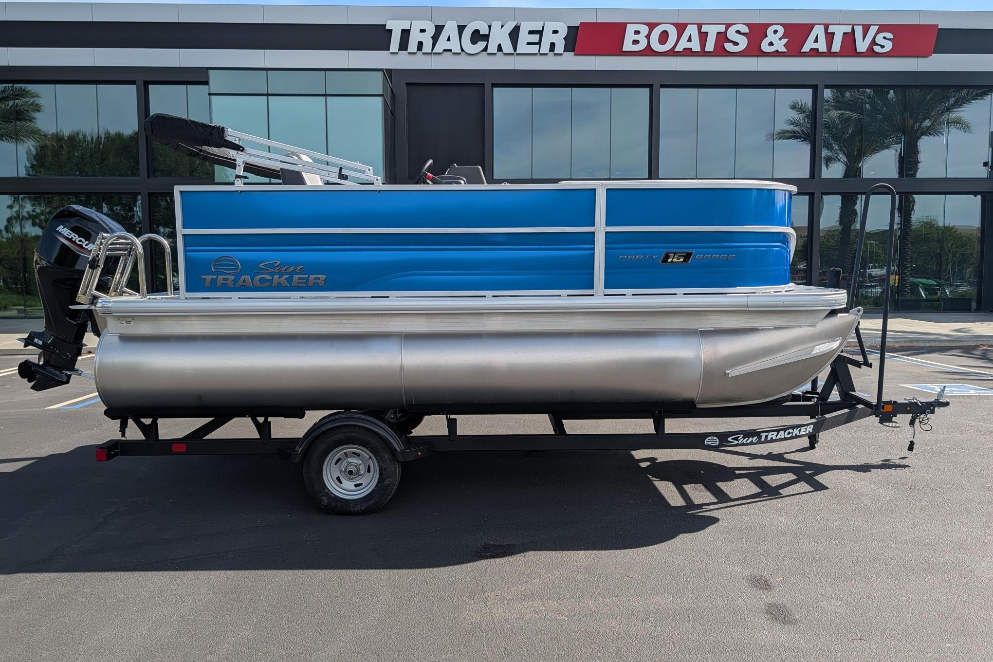 2026 Sun Tracker Party Barge 16 DLX pontoon boat displayed at dealership.