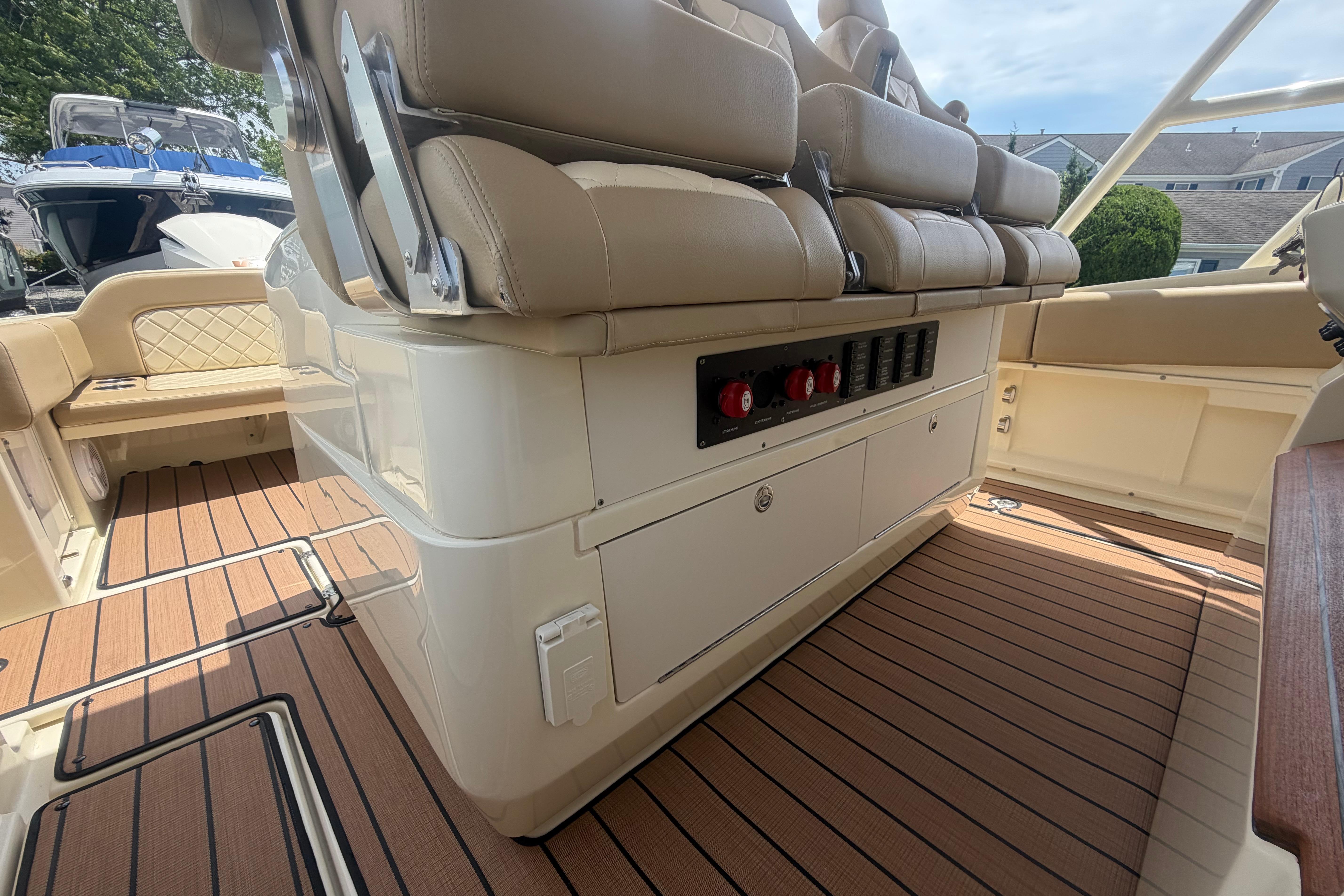 2017 Chris-Craft Catalina 34 interior with beige seating and wood-patterned flooring.