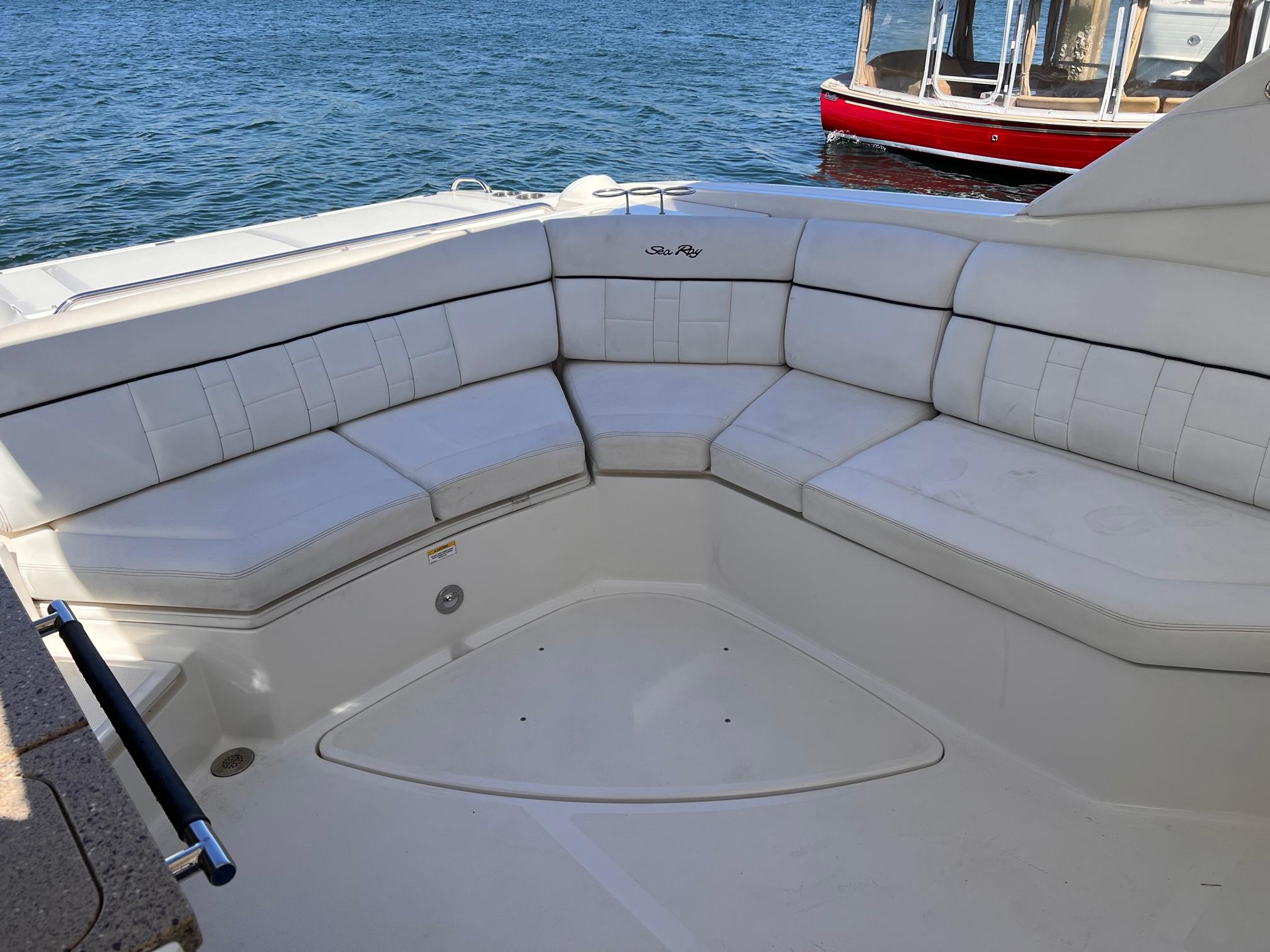 Interior of a 2015 Sea Ray SLX 350 with white seating.