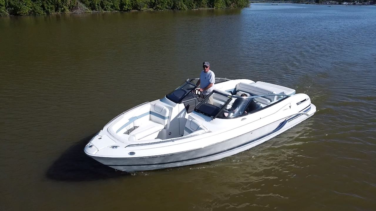 2019 Formula 240 boat on calm water with driver.