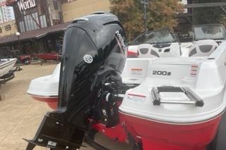 2025 Tahoe 200 S boat with outboard motor, displayed outdoors.