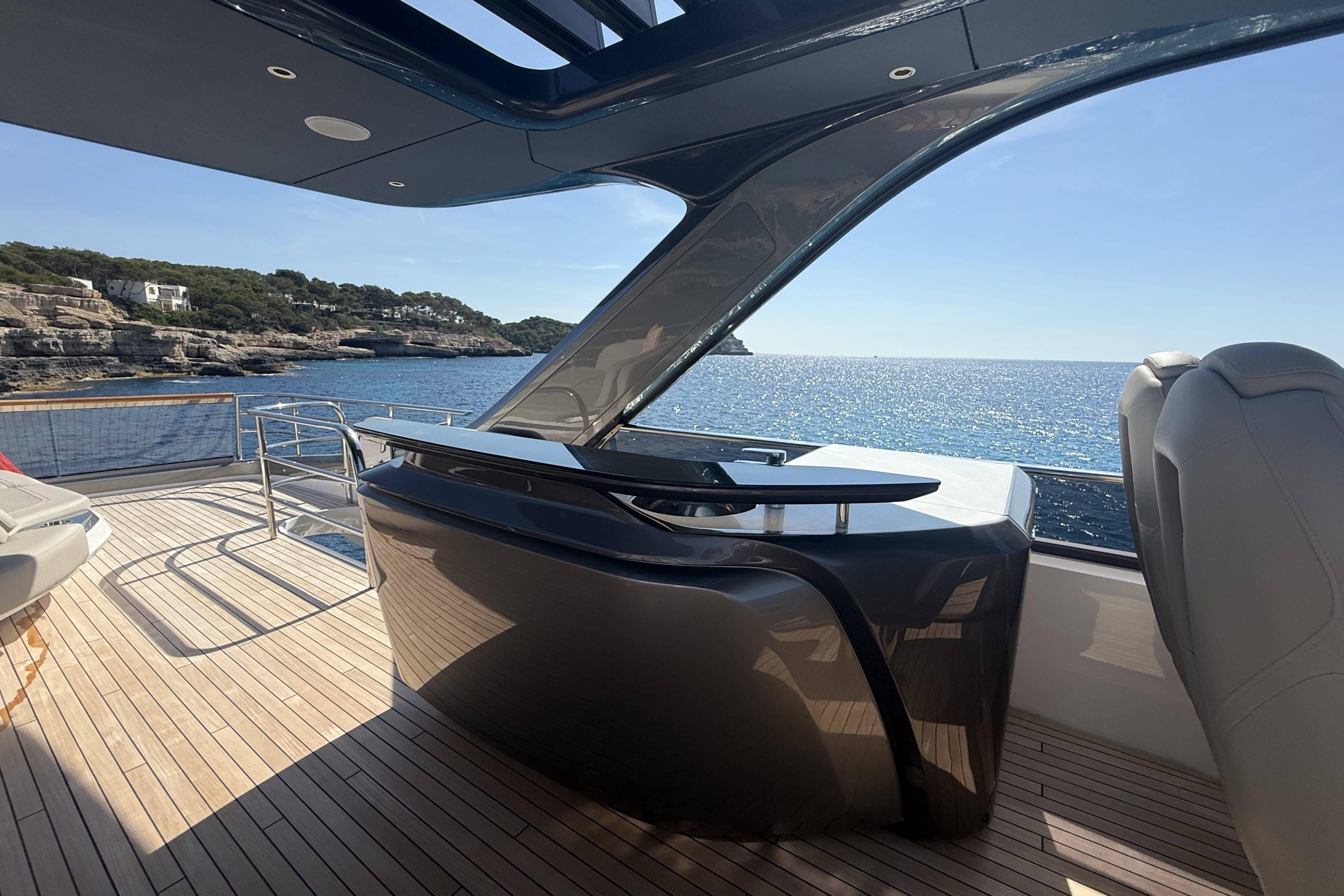 Luxurious 2025 Princess Y72 yacht deck with sleek design and stunning ocean view.