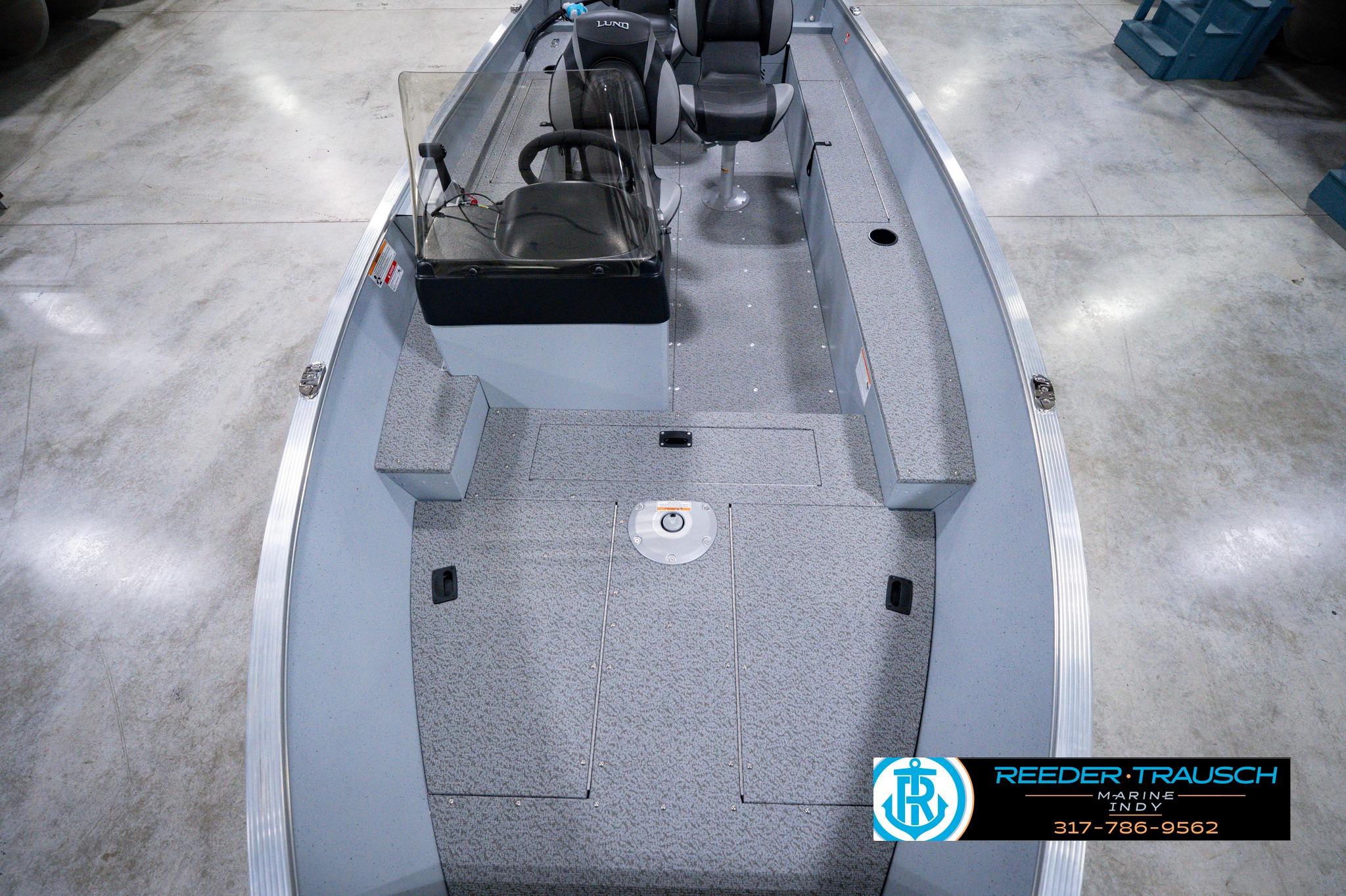 2026 Lund 1600 Fury SS fishing boat interior with seating and steering console.