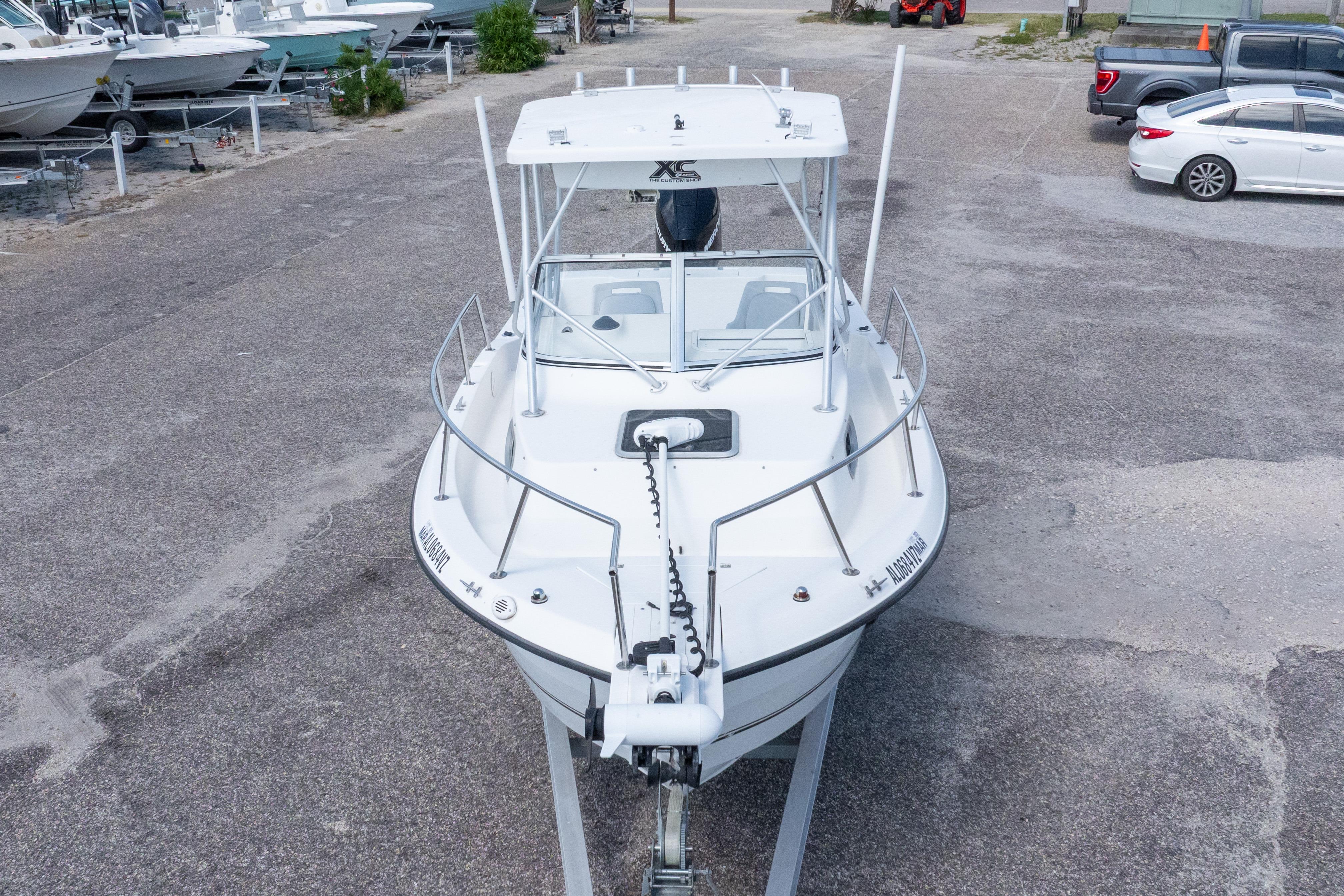2007 Sea Boss 235 Walkaround boat on trailer in parking lot, front view.