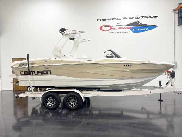 2025 Centurion NV213 boat on trailer in showroom.
