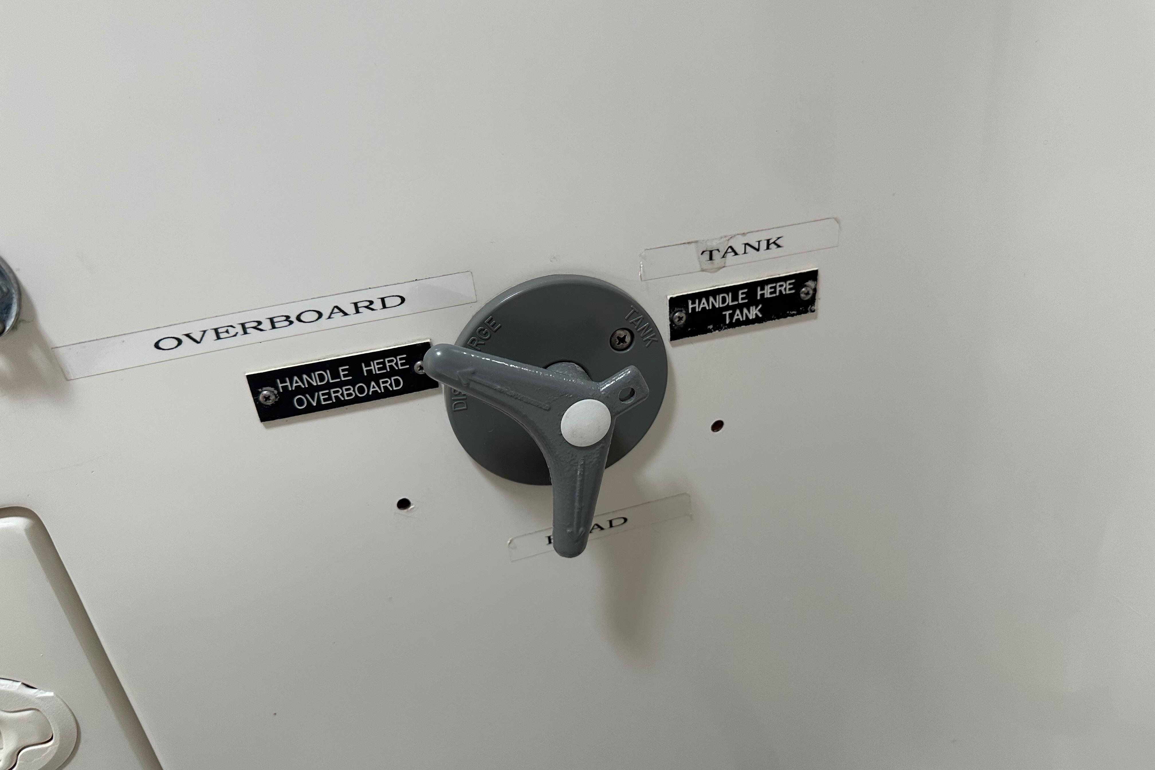 Control valve on 1996 J Boats J/120, labeled for overboard and tank discharge.
