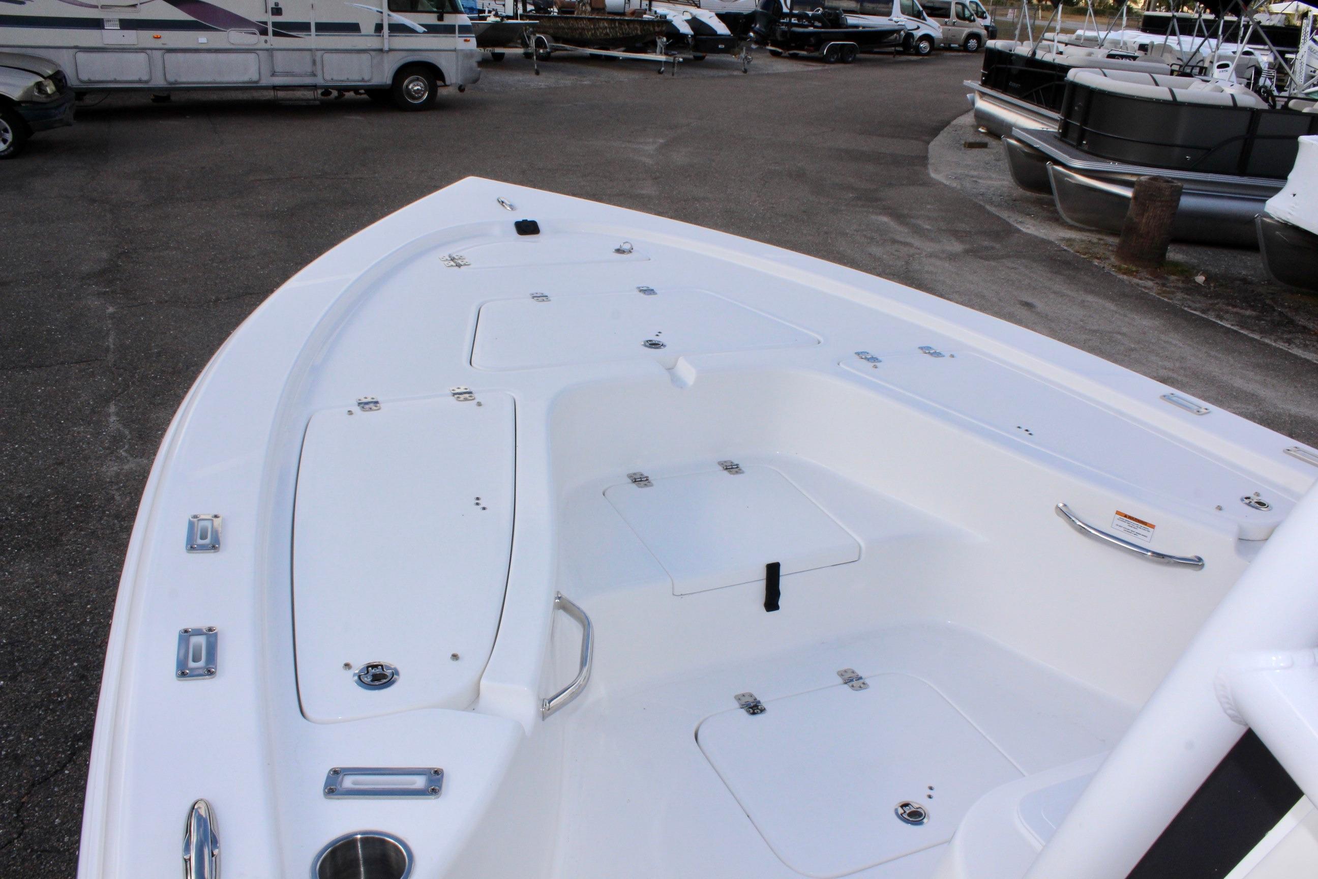 2025 Sea Pro 230 Bay boat deck, featuring storage compartments and sleek design.
