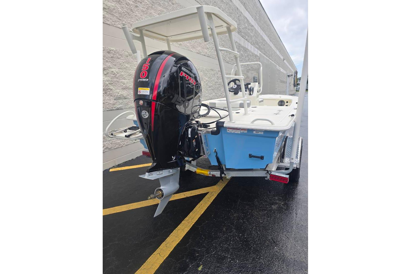 2026 Mako 18 Pro Skiff with powerful outboard motor, parked on a trailer.
