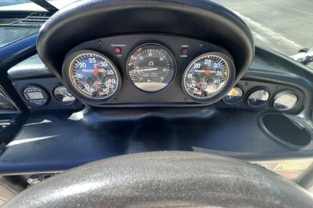Dashboard of a 1996 MasterCraft ProStar 190 boat with gauges and controls.