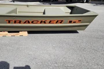2026 Tracker Grizzly 12 Jon boat on pavement, side view.