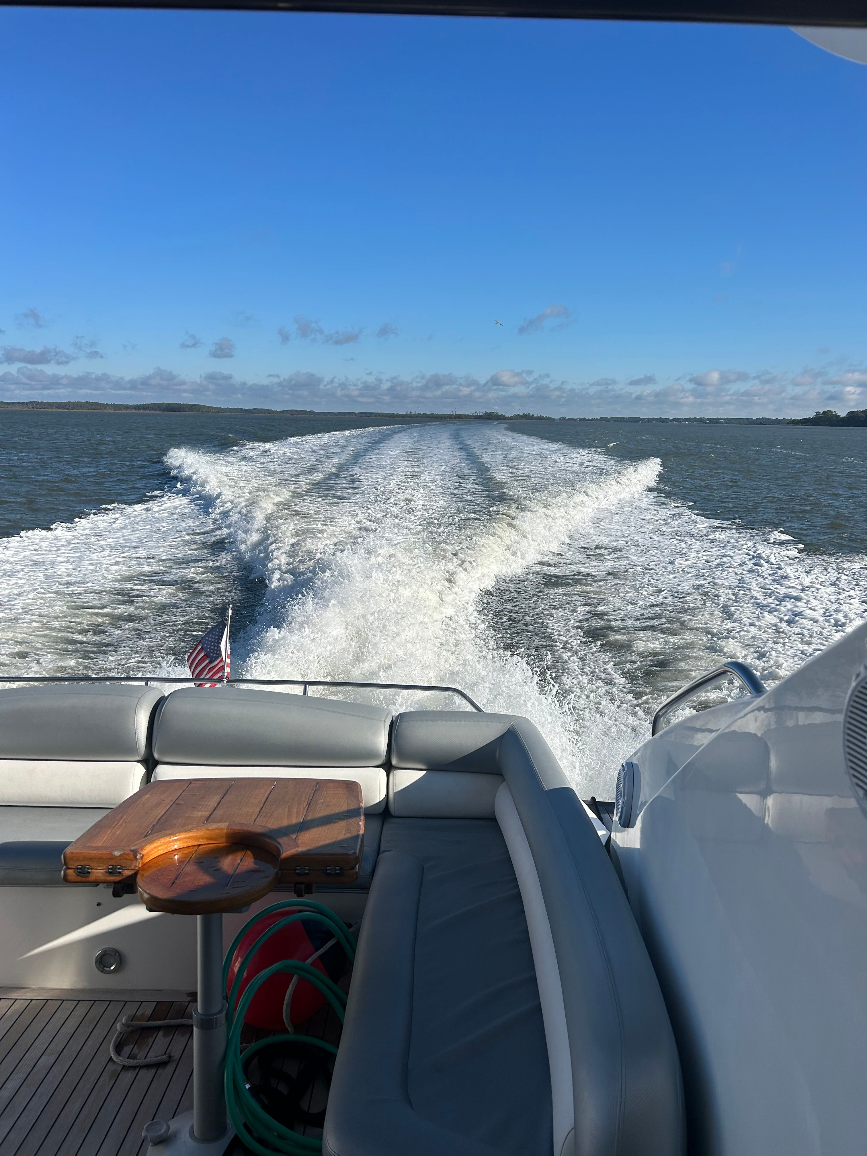 Rear view of a Sunseeker Predator 62 yacht on the water.