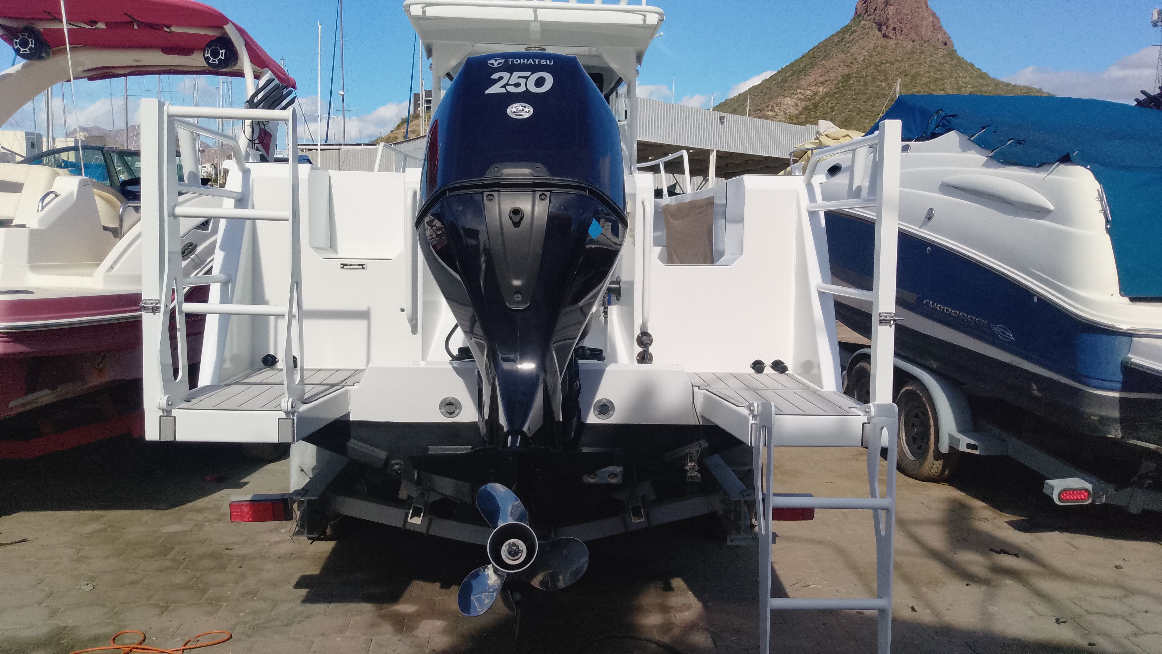 Gospel Boat 7.5M 2024 with Tohatsu 250 engine at dock.