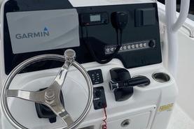 2020 Tidewater 220 CC boat console with Garmin navigation and steering wheel.