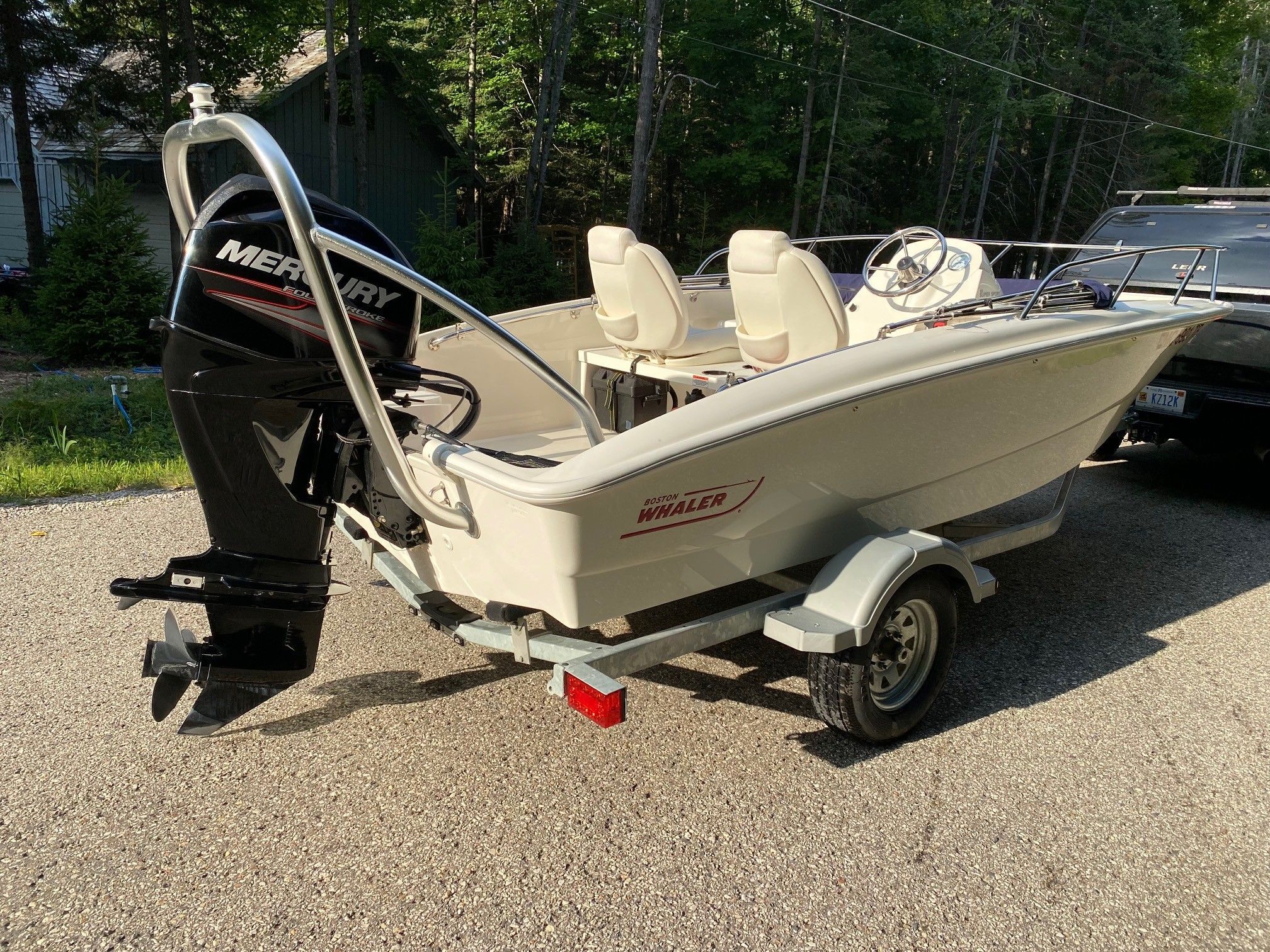 2013 Boston Whaler 150 Super Sport boat on trailer.