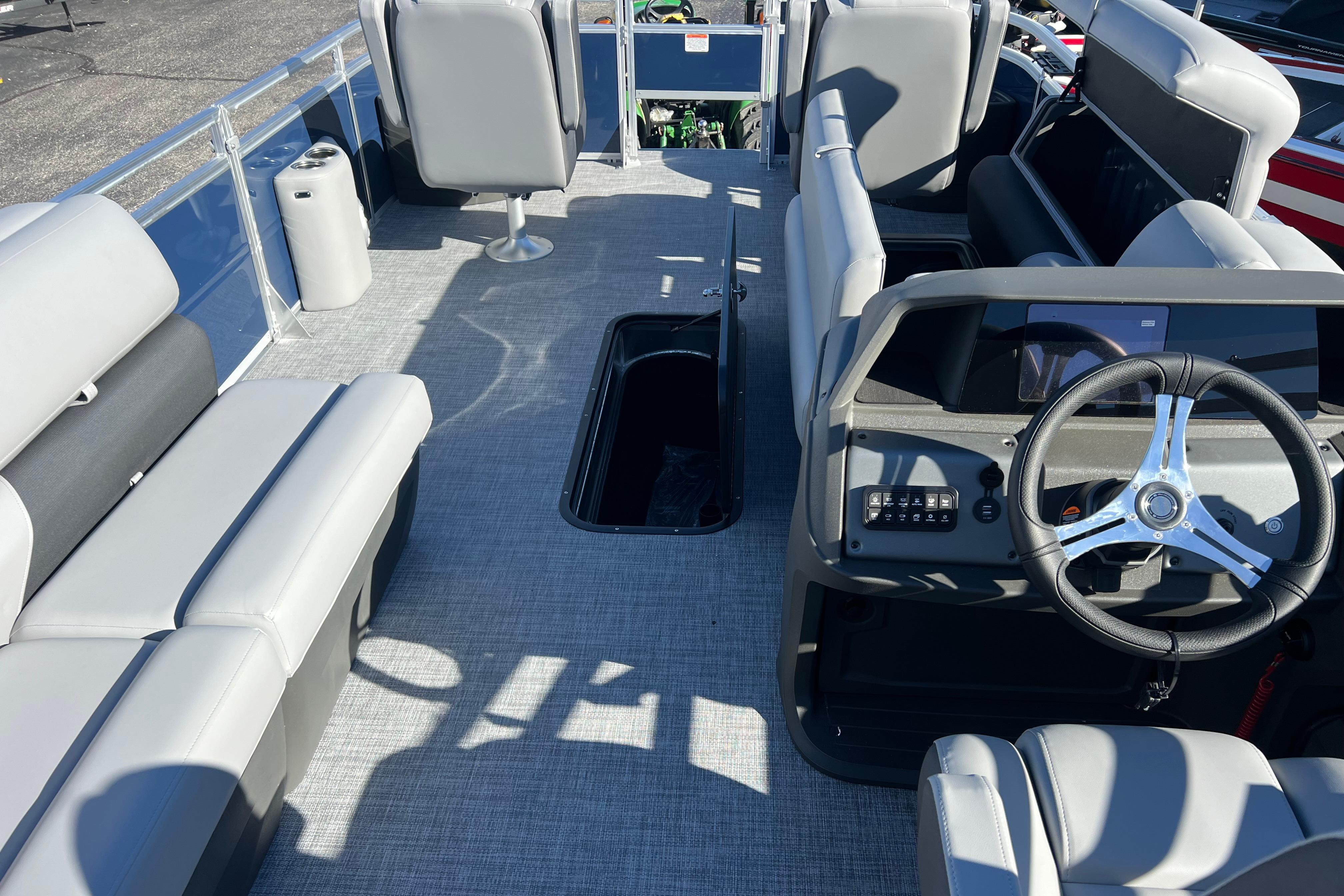 2026 Sun Tracker Sportfish 24 XP3 interior with modern seating and steering console.