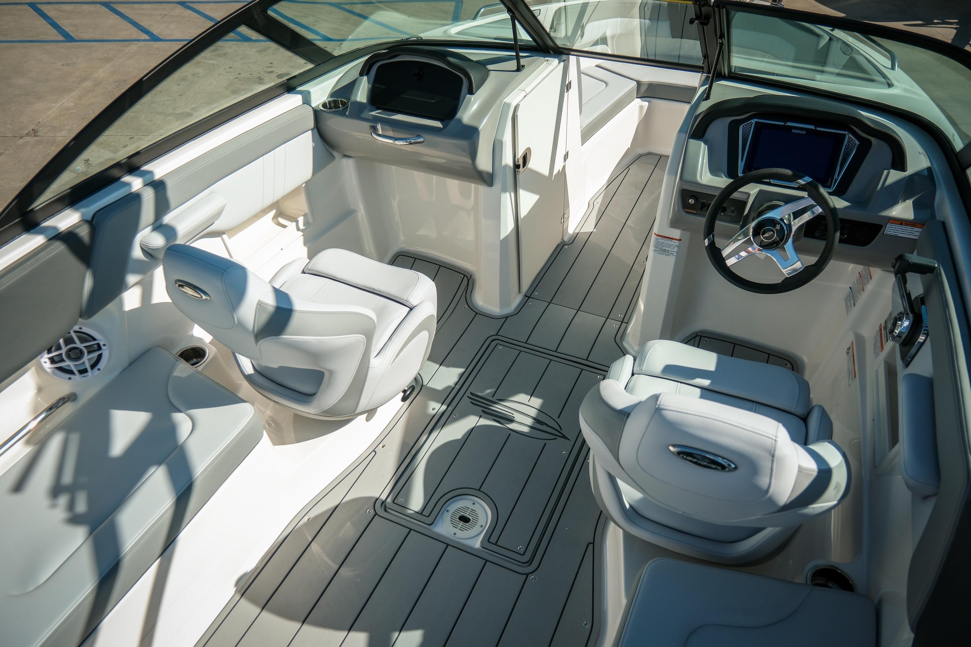 Interior of 2026 Chaparral 23 SSi boat with modern seating and steering console.