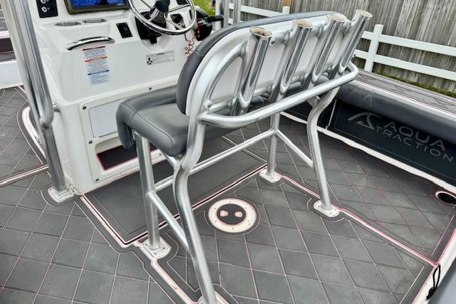 2015 Robalo 226 Cayman boat interior with rod holders and steering console.