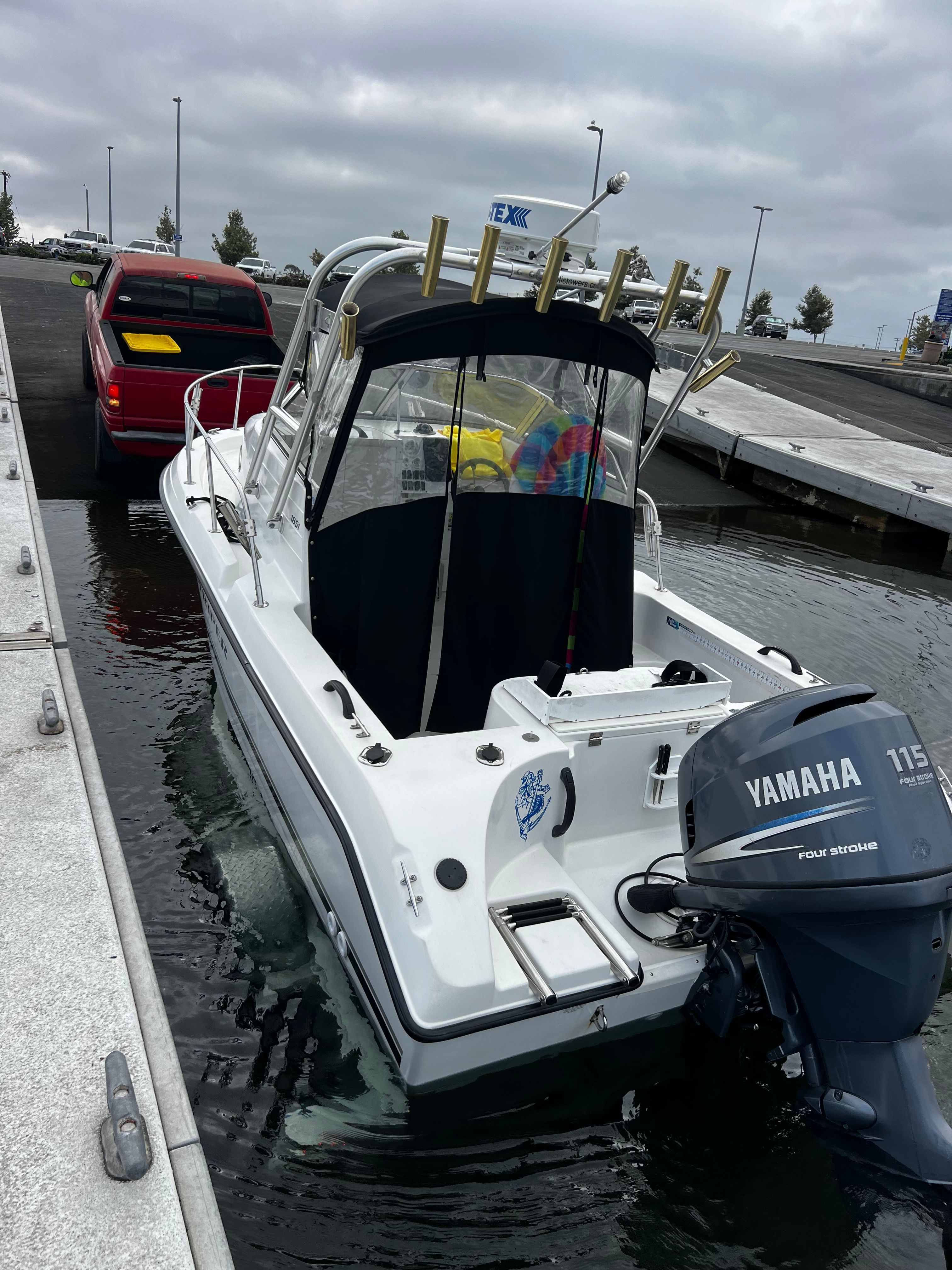 A 2001 Seaswirl Striper 1851 WA with a Yamaha outboard motor docked at a pier.