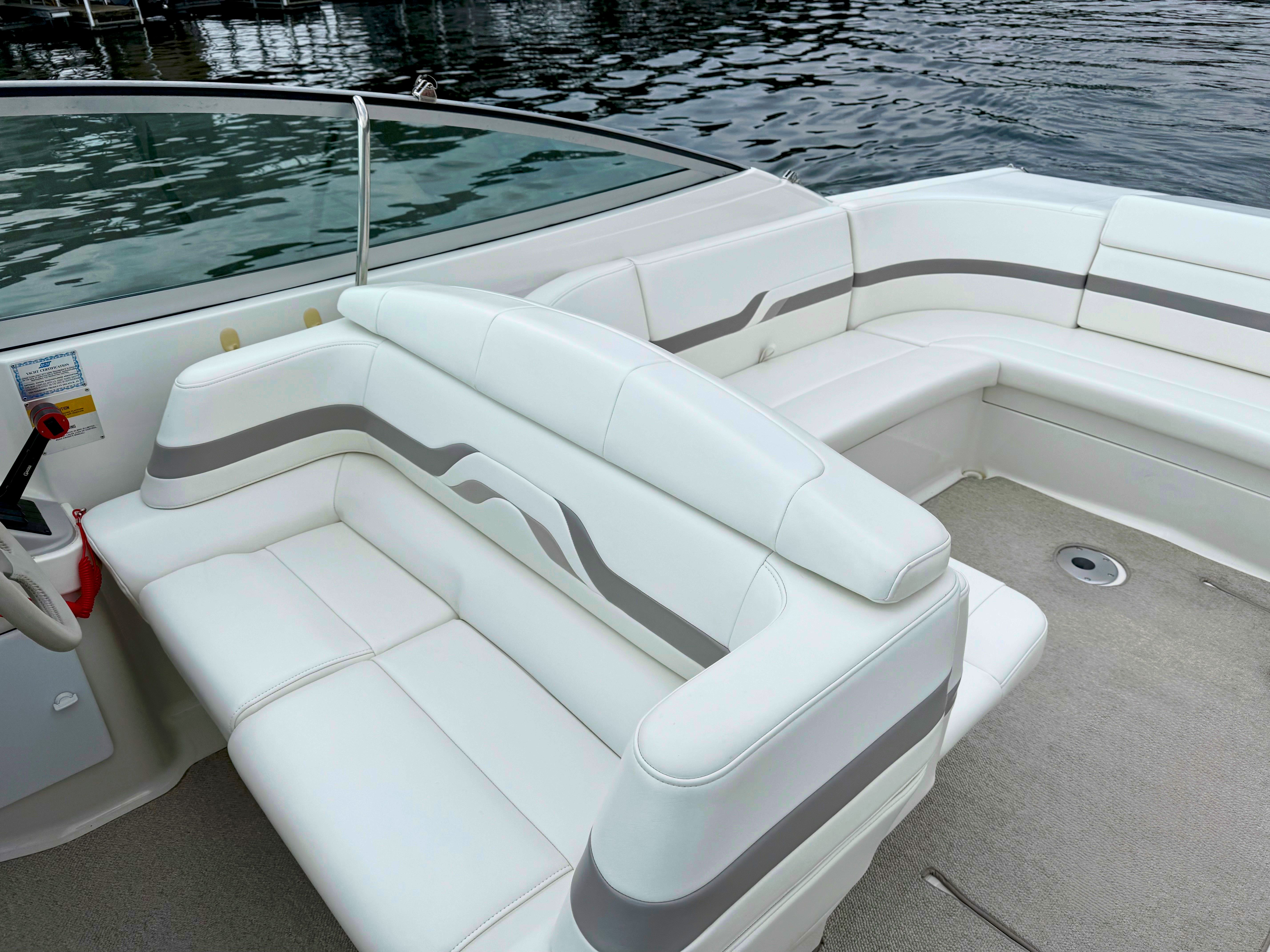Interior of a 2001 Formula 330 Sun Sport boat with white seating.