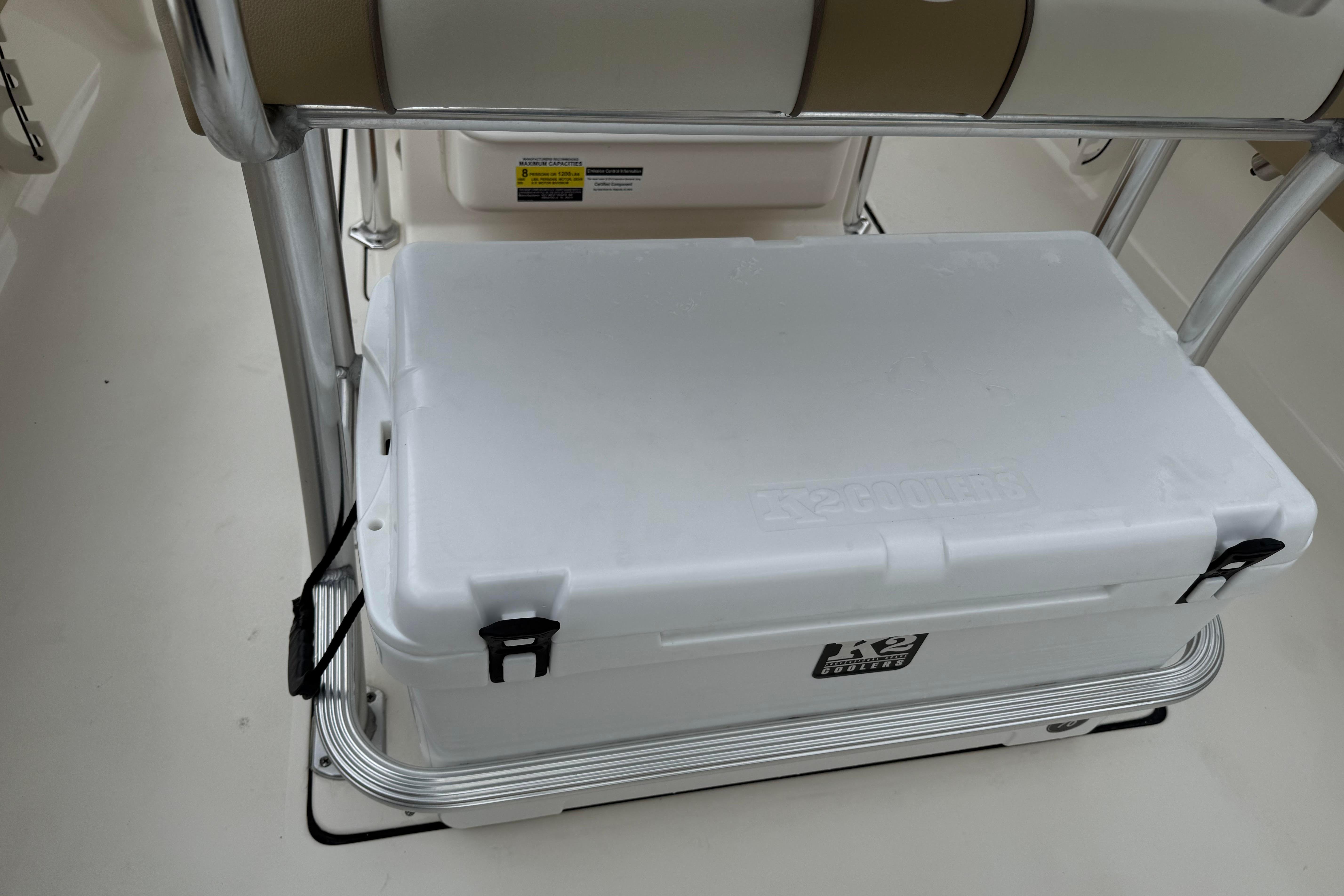 2017 Key West 246 Bay Reef boat with a white cooler secured under a seat.