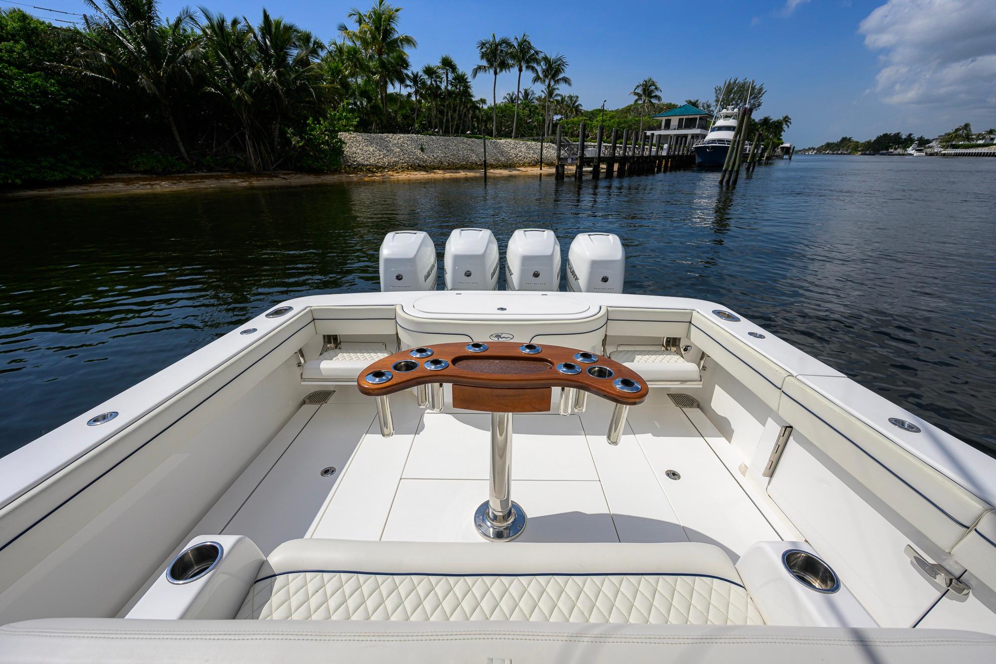 2020 Valhalla Boatworks V-41 with quad engines, docked in a scenic waterfront setting.