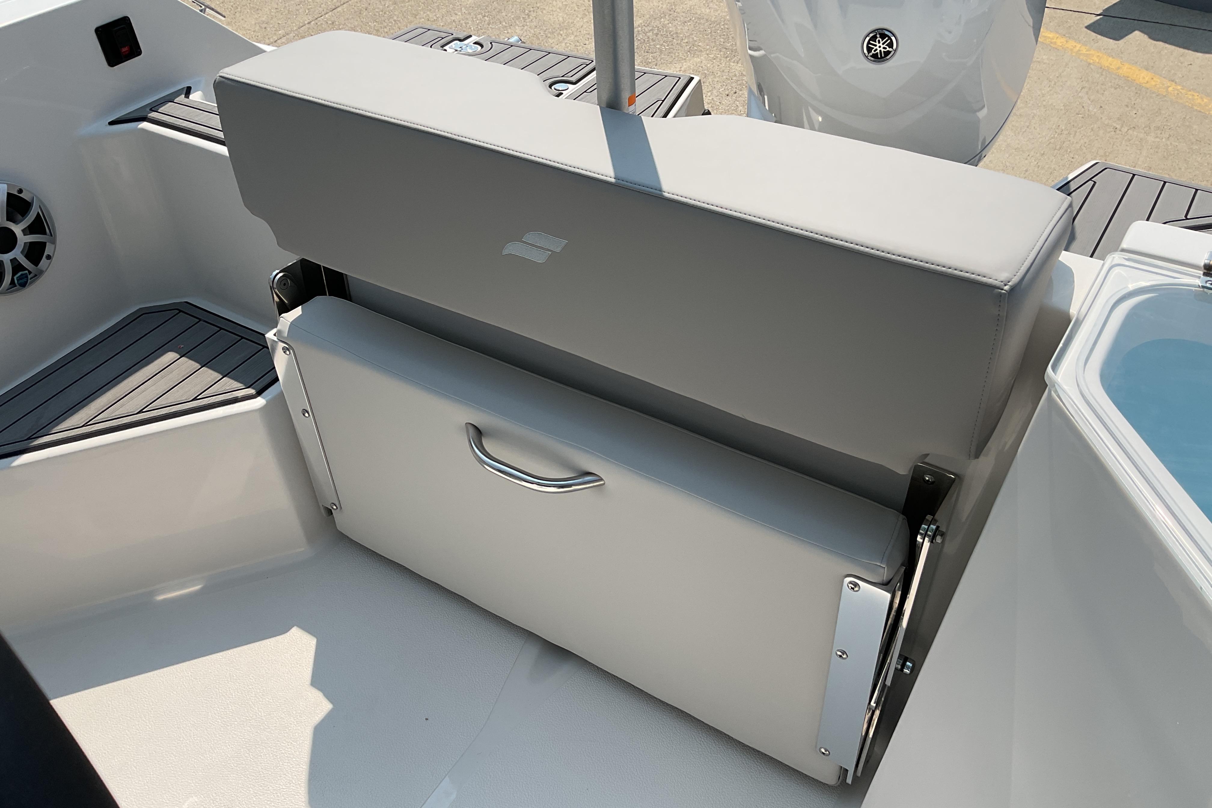 2026 Starcraft SVX 231 OB CC boat seat with storage compartment and sleek design.